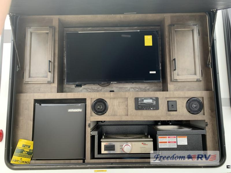 Outdoor kitchen and entertainment center